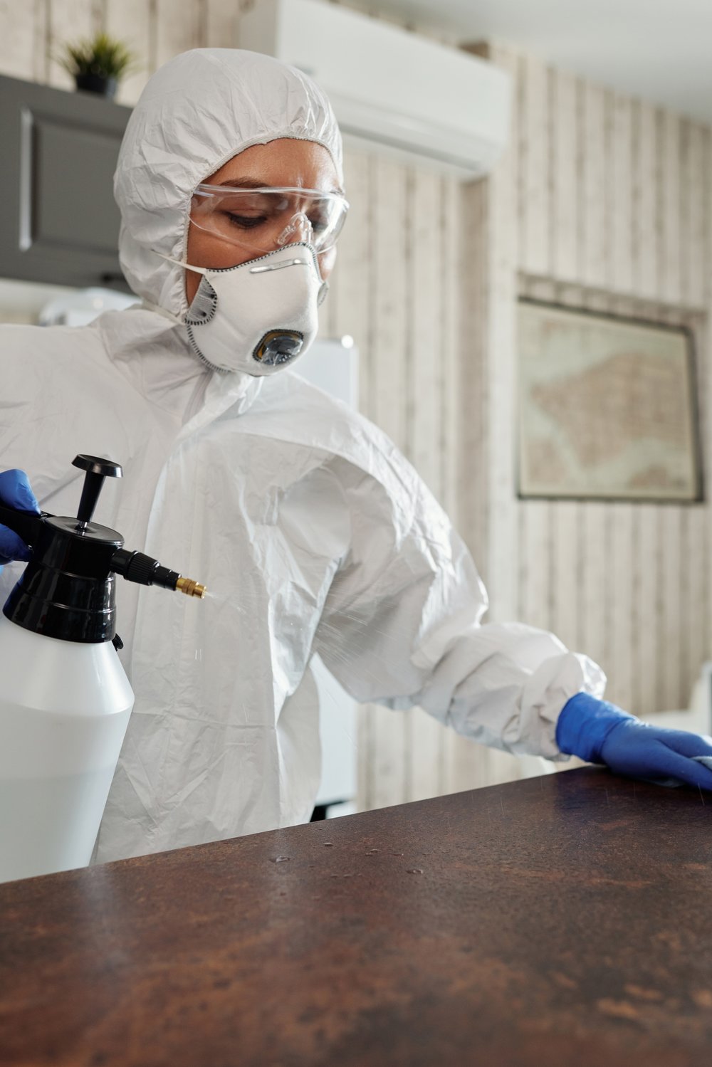 Girl disinfecting a table bar