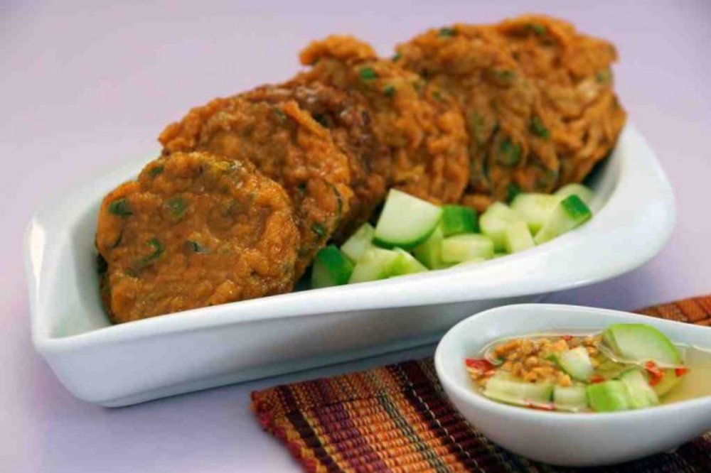 Fish cakes in a plate with vinegar