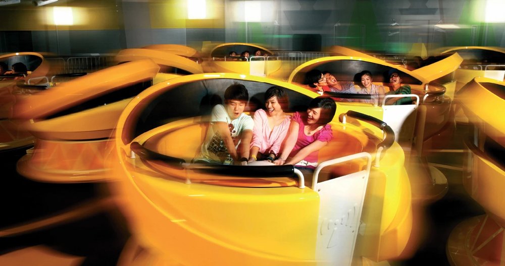 People riding a bump accelarator car