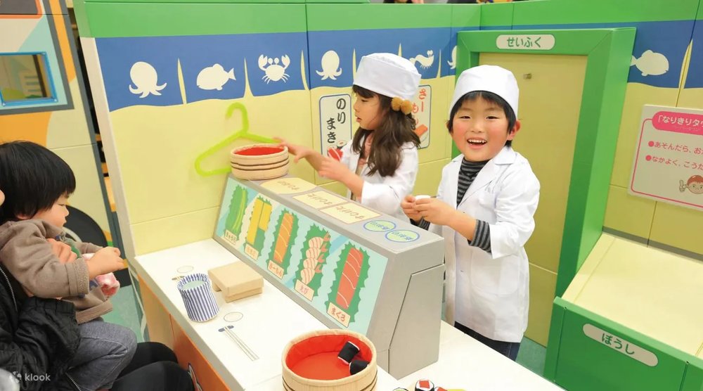 Kids in a make-up sushi restaurant
