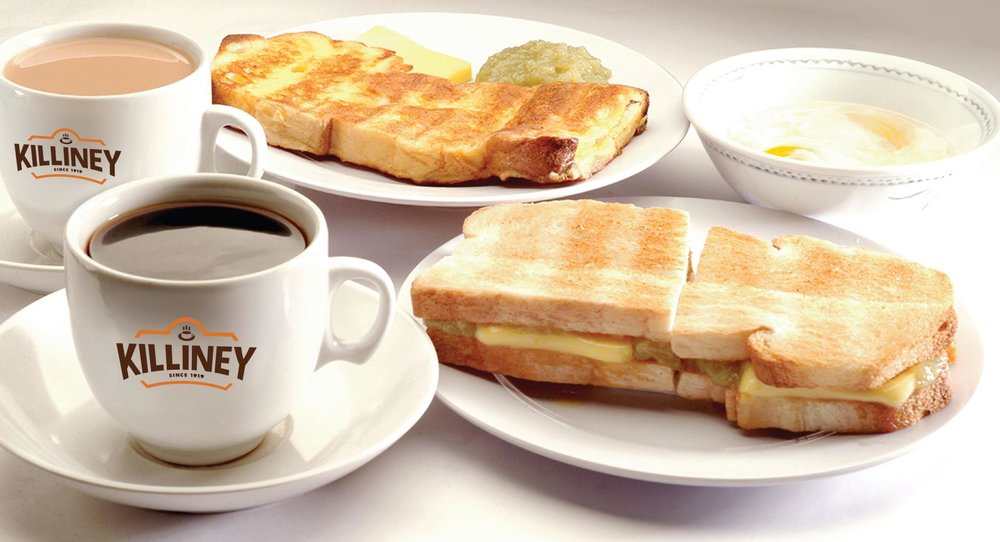 Classic toasted bread with cheese an a black coffee