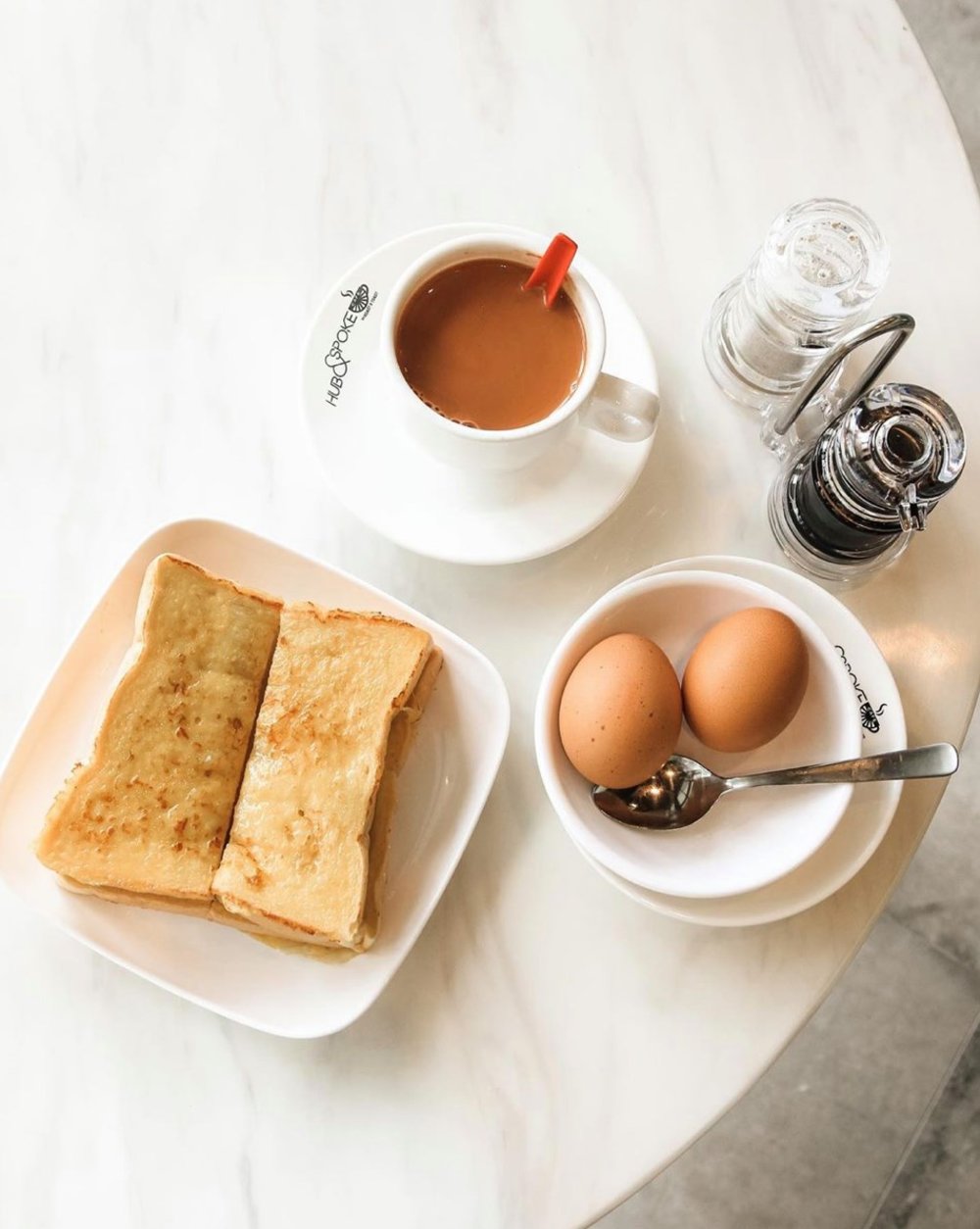Toasted bread, coffee and two boiled eggs