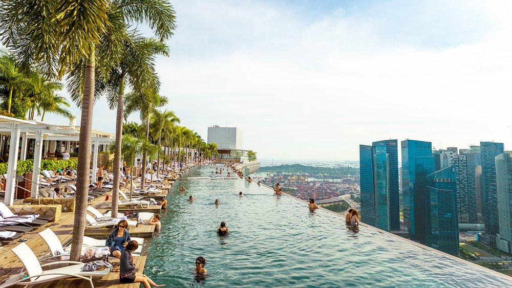 People swimming in the pool above the Marina Bay Sands Tower