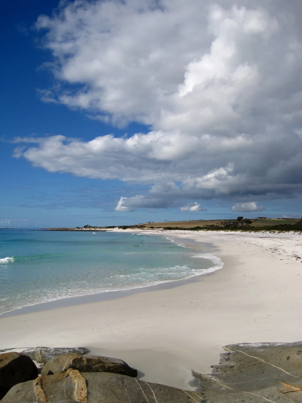 The beach under giant clouds