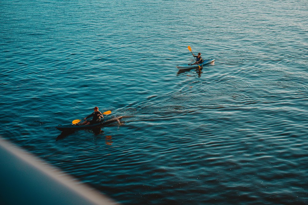 Two people kayaking around Huon River