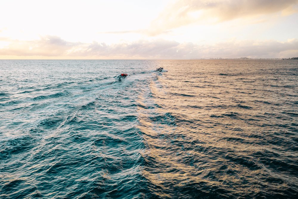 People on jet boats in the sea