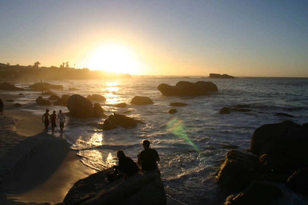People watching the sunset on Clifton Beach