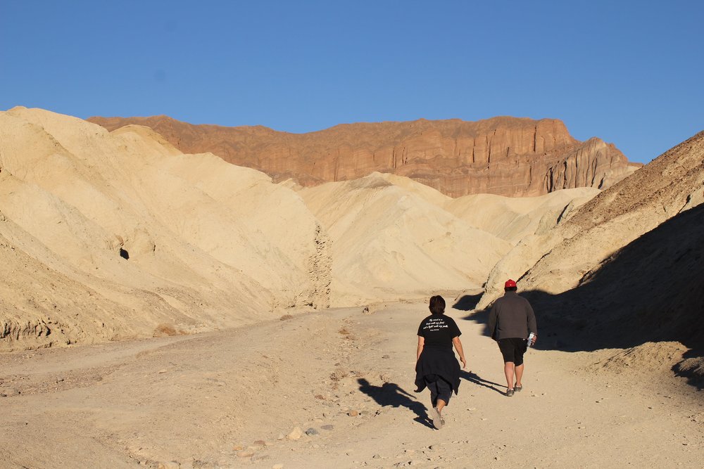Man and woman walking on a desert