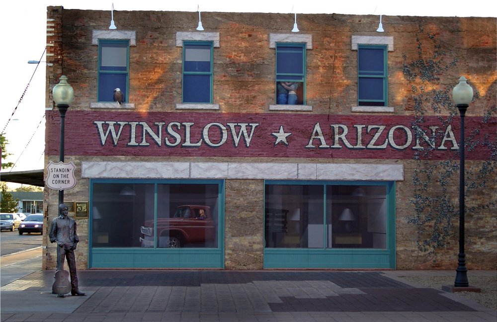 A storefront with a Winslow and Arizona signage