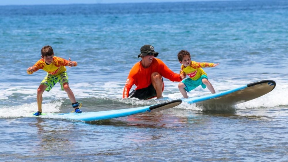 Even your little ones can learn to surf at Ka’anapali Beach! Credit: @kaanapalisurfclub on Instagram