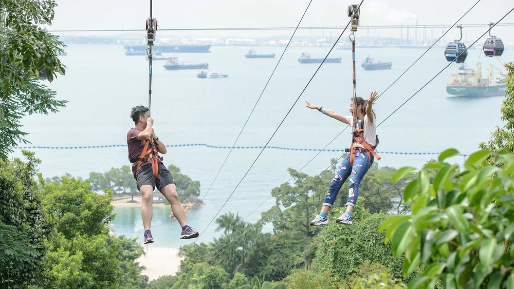 Couple riding a zipline