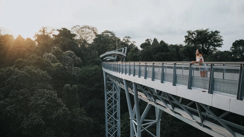 a girl hanging out in a gray bridge