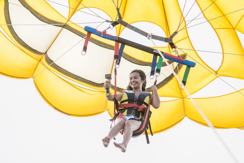 Girl enjoying her parasailing