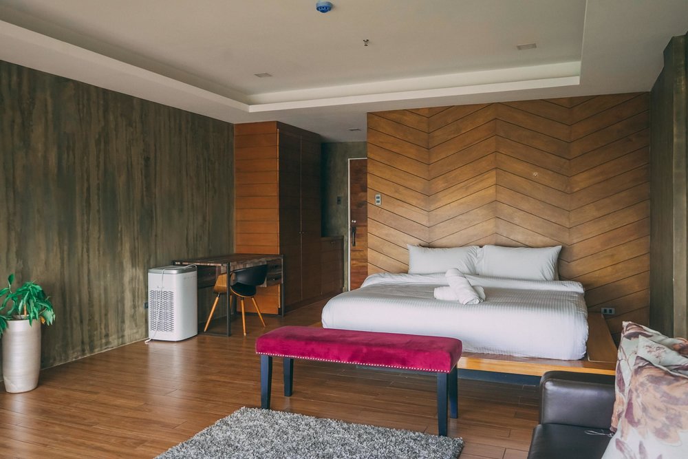 White bed with red chair