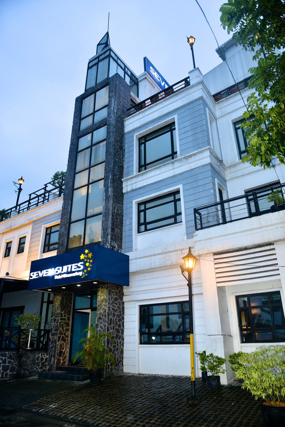 Seven Suites exterior with light 