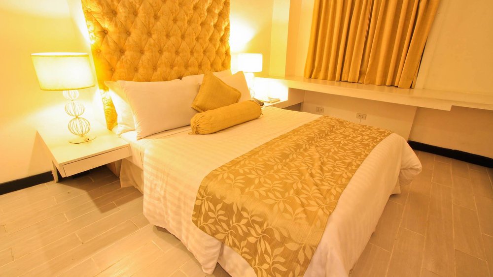 Bed with yellow surroundings