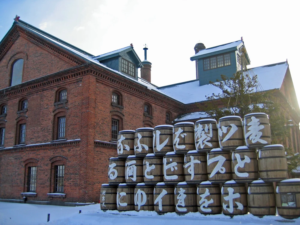 Stacked beer kegs in the snow