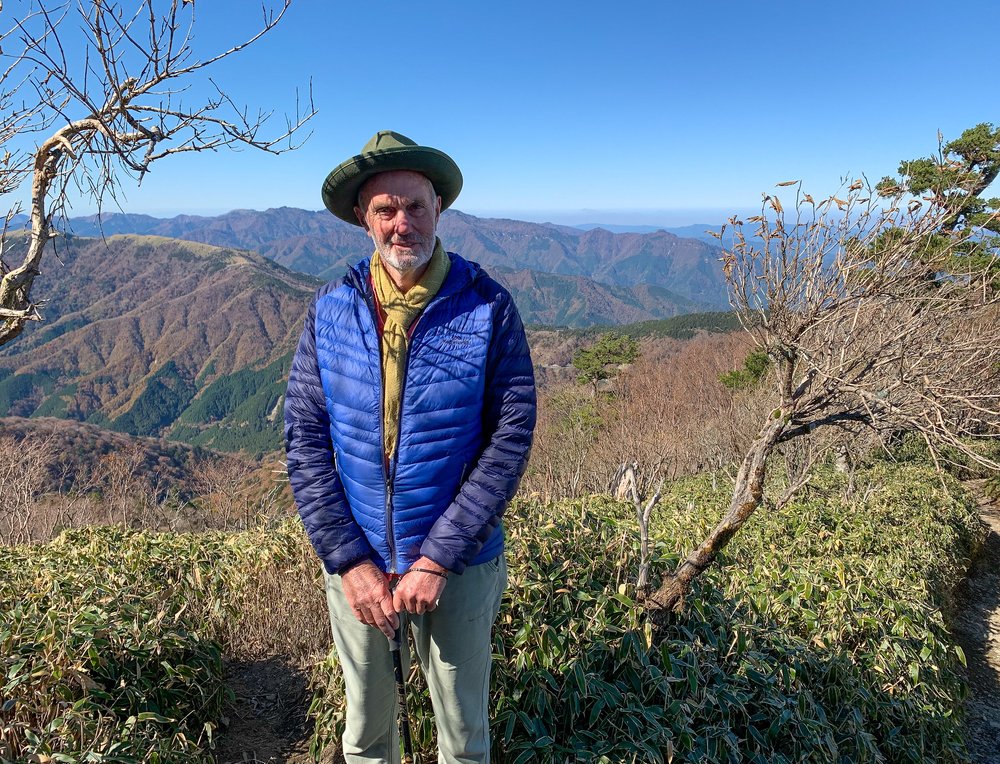 a man standing somewhere in Mount Tsurugi posing for a photo