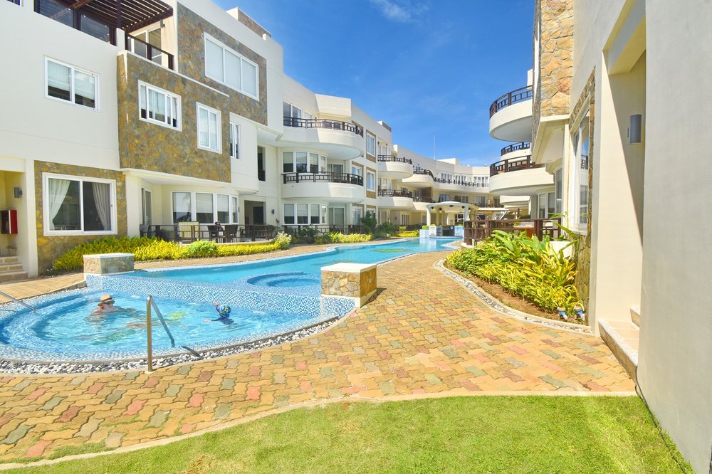 Pool surrounded by stone buildings