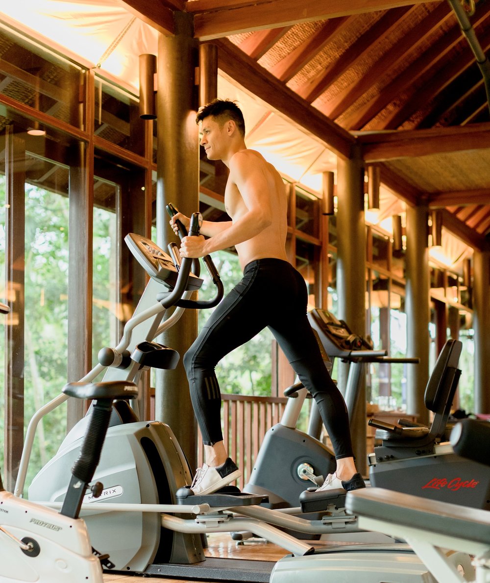 Man doing elliptical exercise