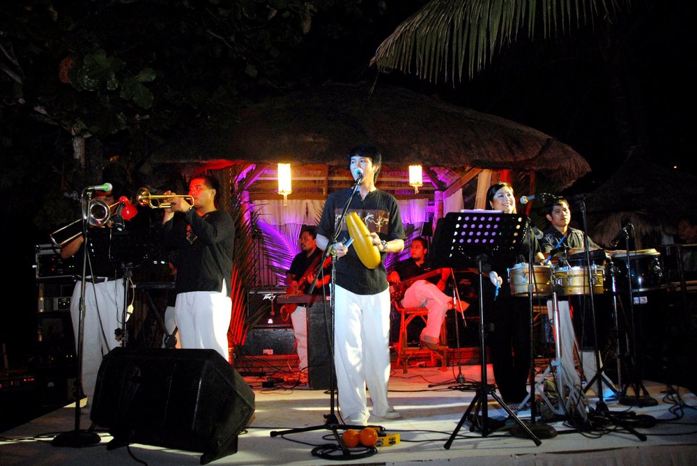 Performers on stage singing