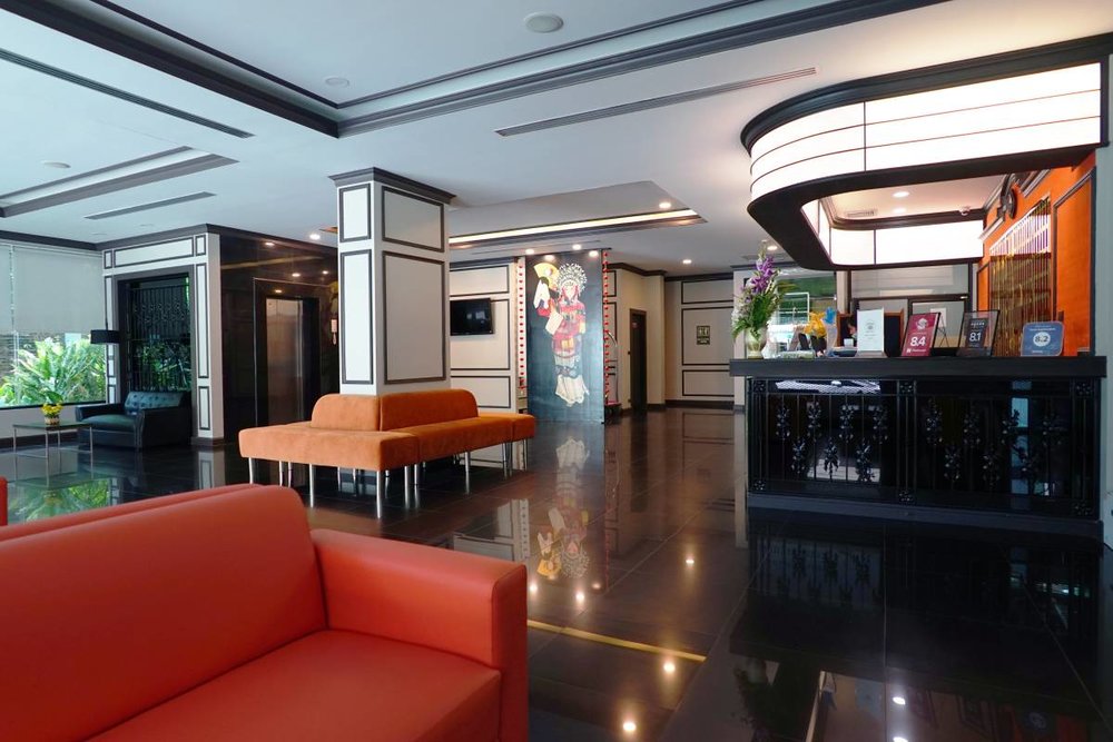 Black tiles and orange couch