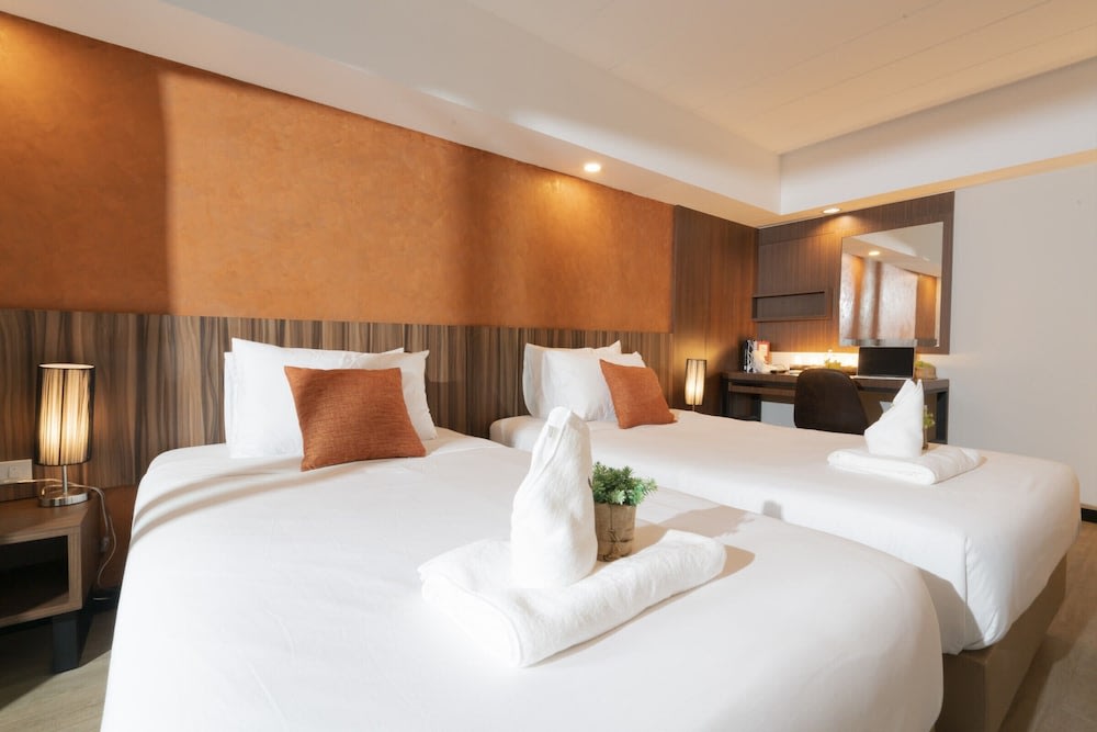 Two bed with orange pillow cover