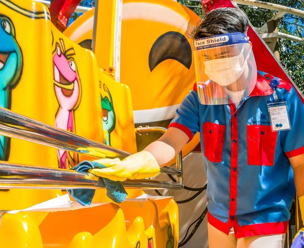 Man disinfecting the hand rails