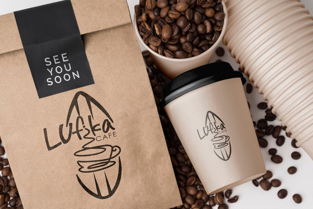 Coffee beans in bag and a coffee cup