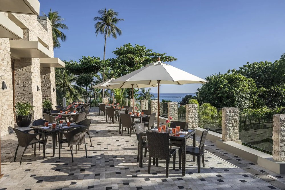 Chairs and tables with umbrella