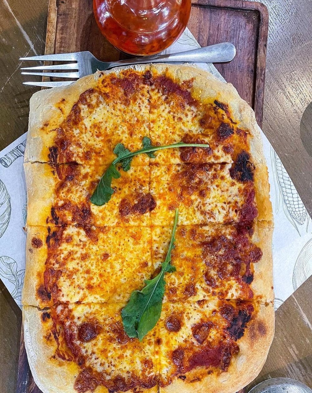 Crispy pizza with leafs