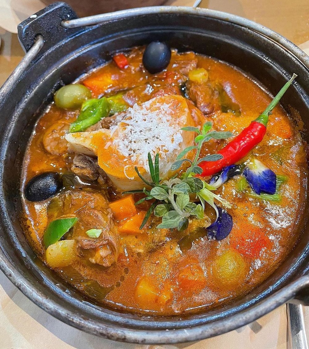 Pot with orange sauce