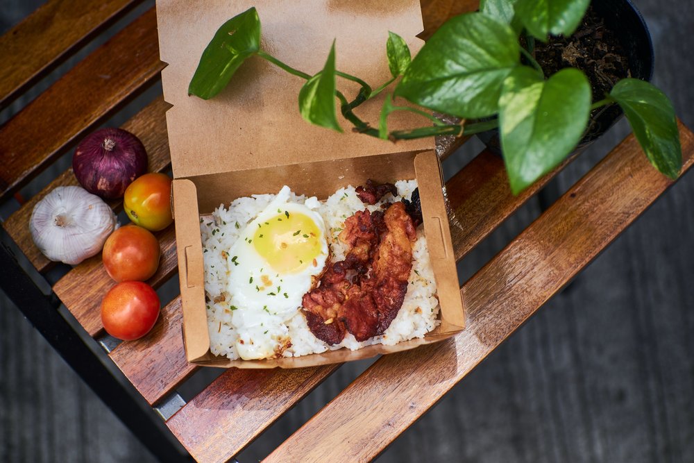 Egg and fish in takeout box