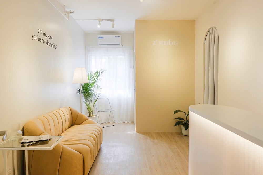 Beige couch and white curtain