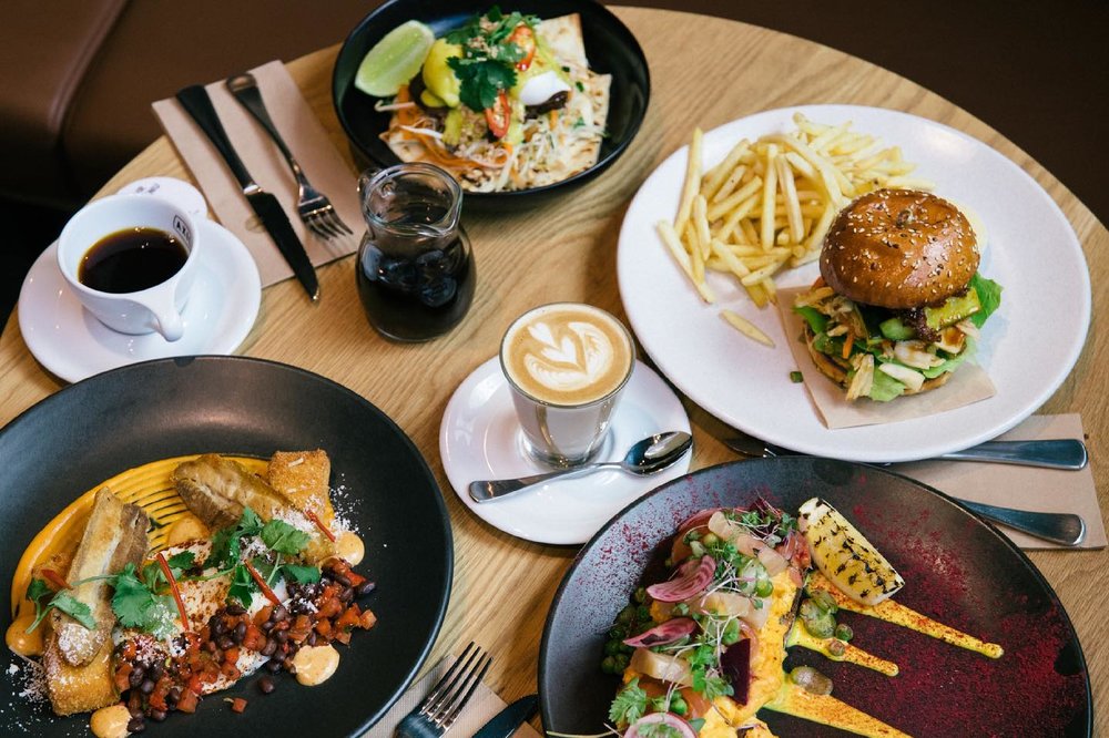 Burgers, pasta and coffee in the table
