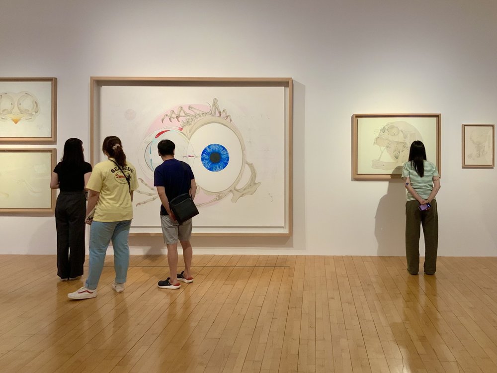 Persons looking at art