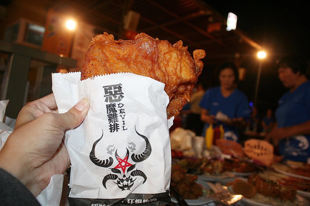 Hand holding big chicken