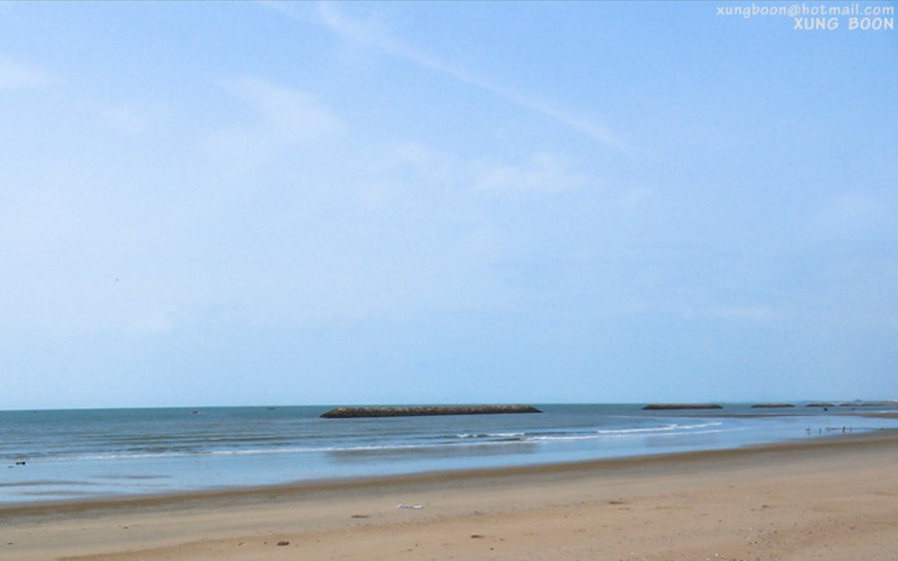 Blue water and brown sand