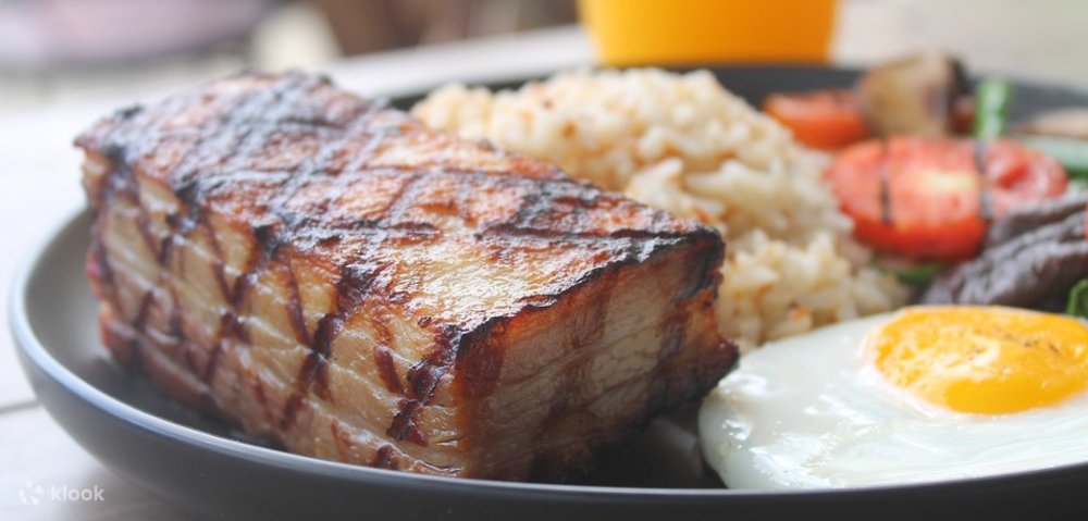 close up shot of bacon slab and rice