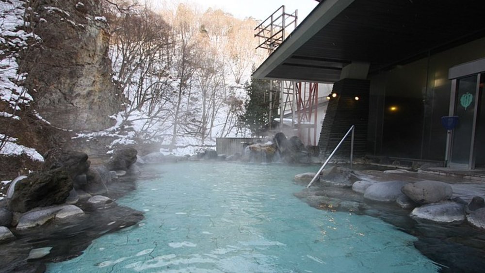 Soak in an onsen after a long day of skiing.