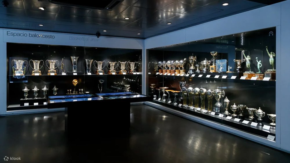 a room full of trophies won by Real Madrid's football and basketball teams