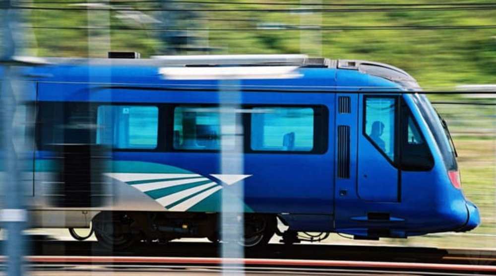 A blue airport express train