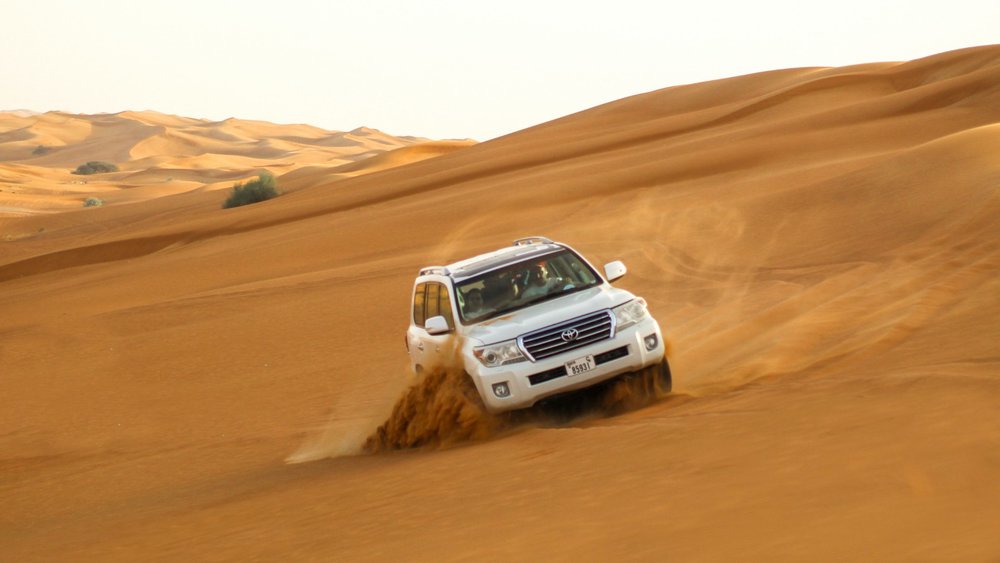 Brave through the sand dunes of Dubai on a thrilling dune-bashing adventure.  Credit: @hariskhan488 on Unsplash