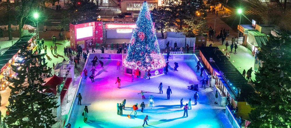 People skating on rink