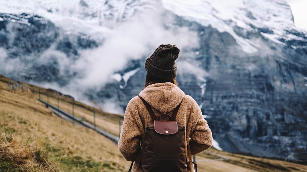 a girl standing atop the Jungfraujoch