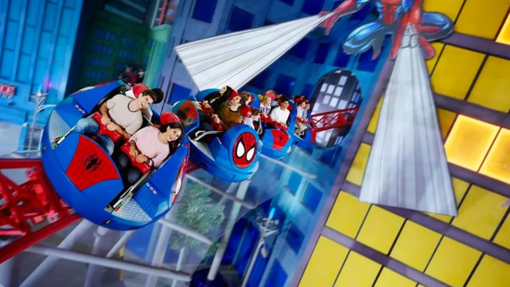 people having fun on the Spiderman ride in IMG Worlds of Adventure