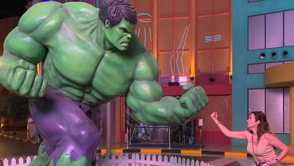 a woman posing with The Hulk