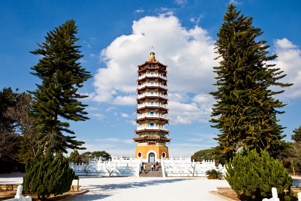  A tall brown and white temple 