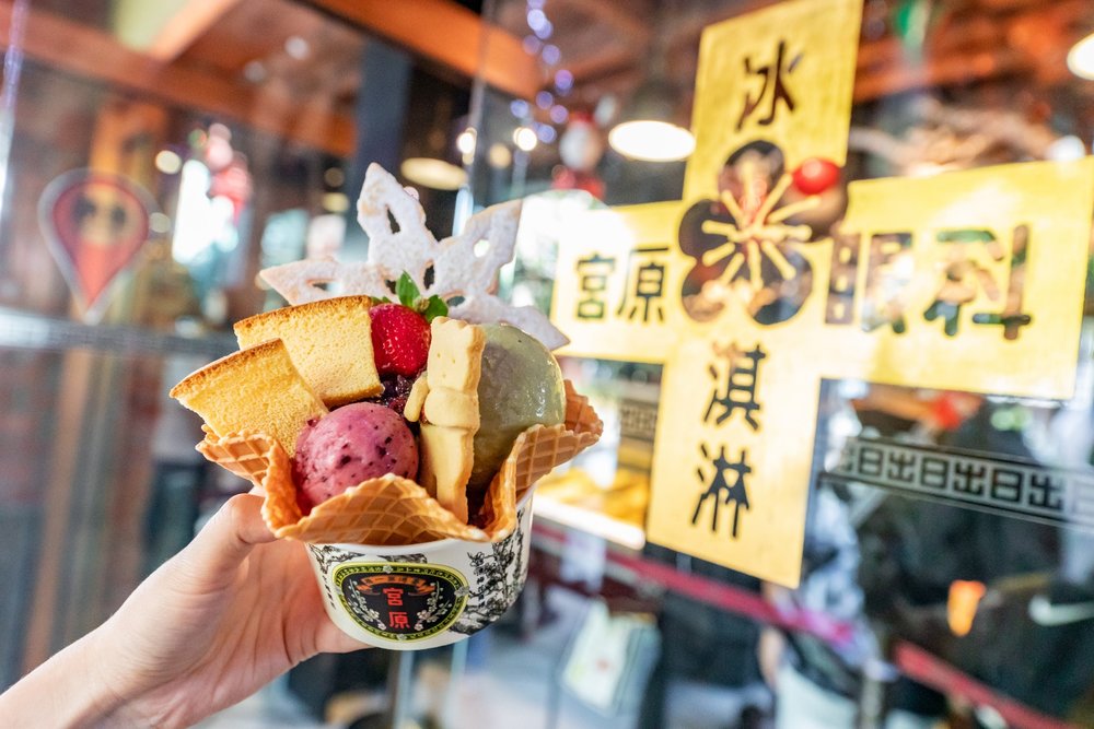 Fruits, ice cream, and biscuits in a waffle cone