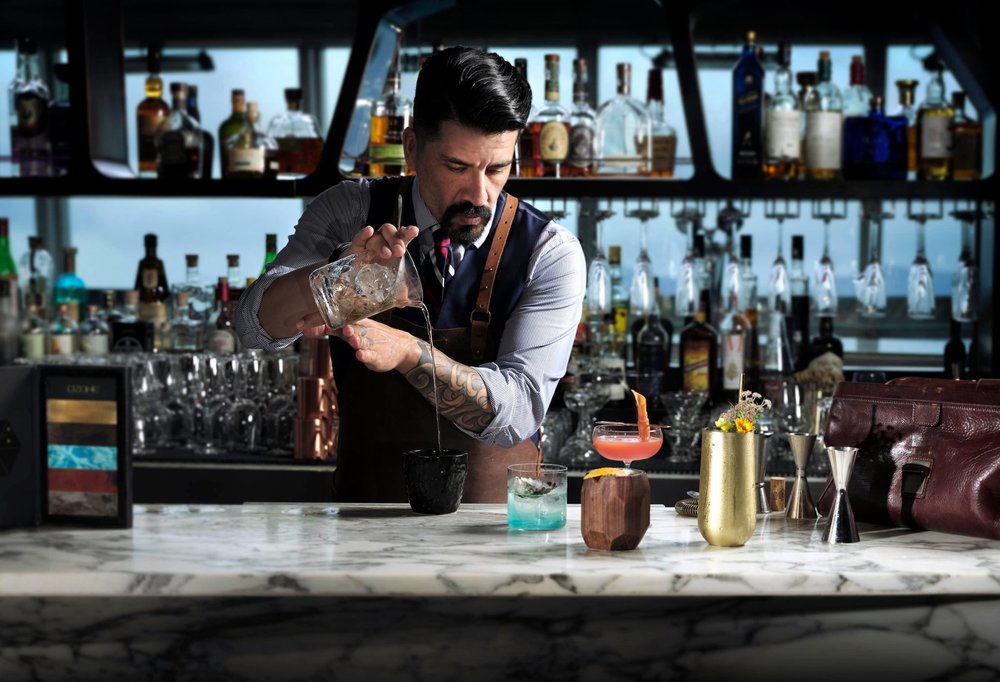 Bar tender mixing drinks